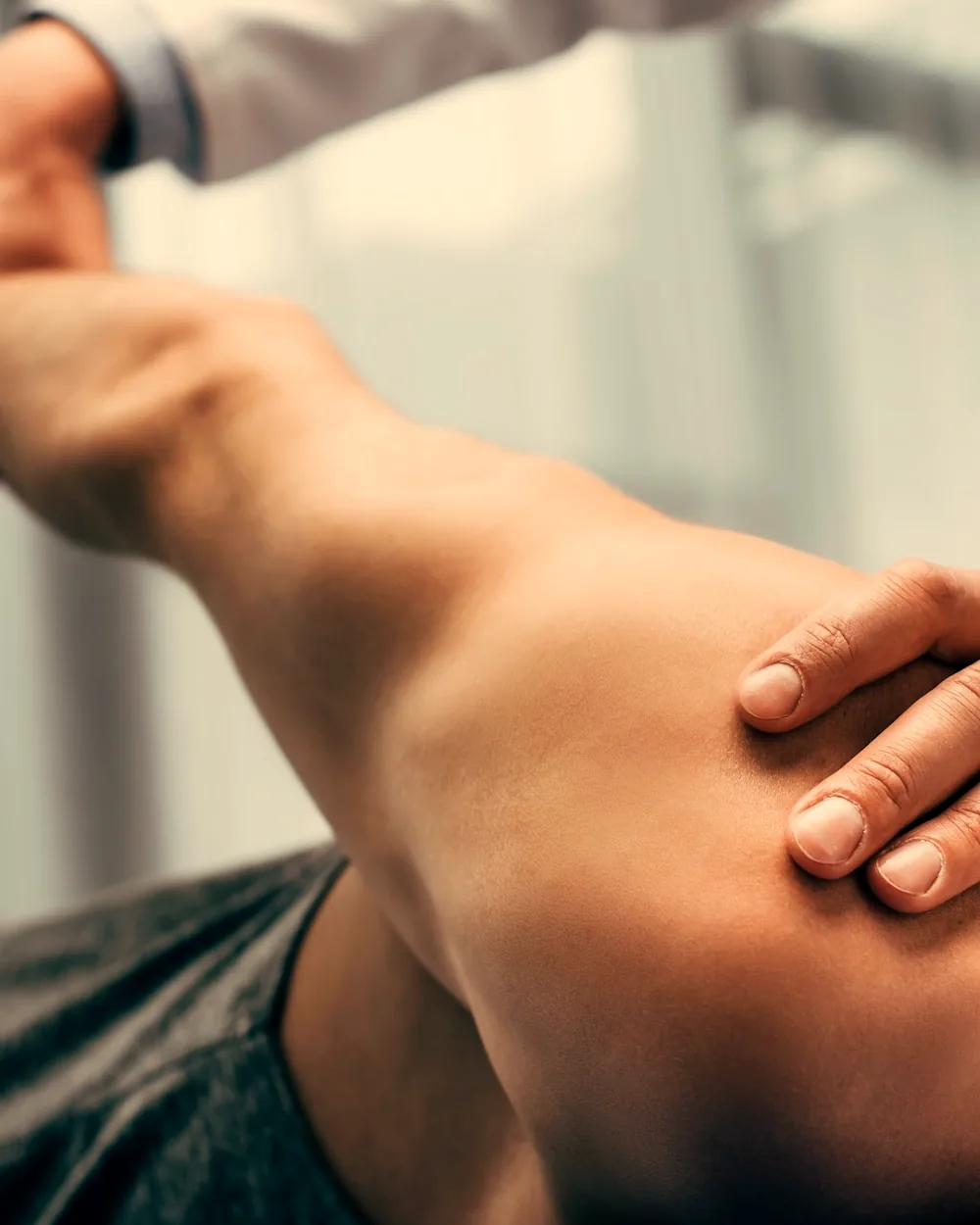 Dr. Grayson delivering gentle hands-on chiropractic care at Abundant Health in Stoughton, WI